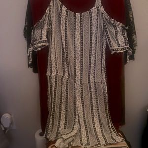 This is a black and white romper size large. Never worn perfect condition